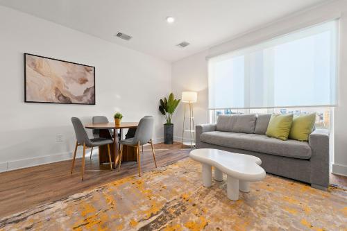 a living room with a couch and a table at The Nomad ATL in Atlanta
