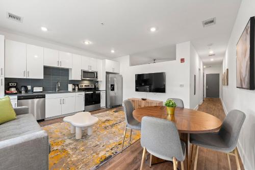 a kitchen and living room with a table and chairs at The Nomad ATL in Atlanta