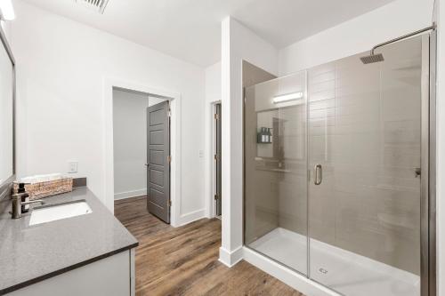a bathroom with a shower and a sink at The Nomad ATL in Atlanta