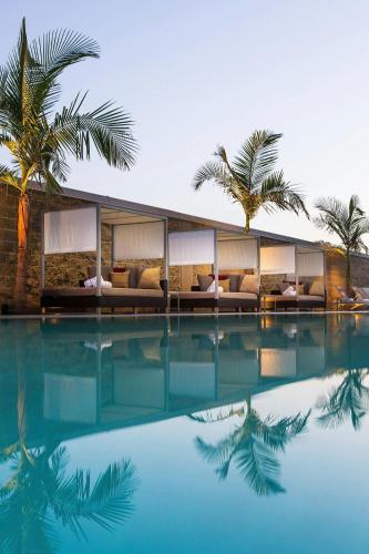 a resort with palm trees and a swimming pool at Residence Inn by Marriott Los Angeles L.A. LIVE in Los Angeles