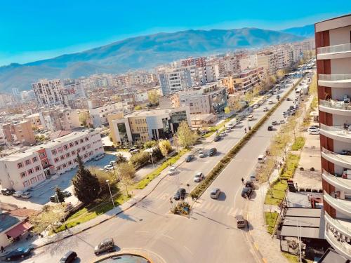 an aerial view of a city with buildings and a street at Queen Ekaterina II in Vlorë