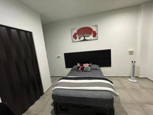 a bedroom with a bed in a room at Estudios Rios Habitación in Zamora de Hidalgo