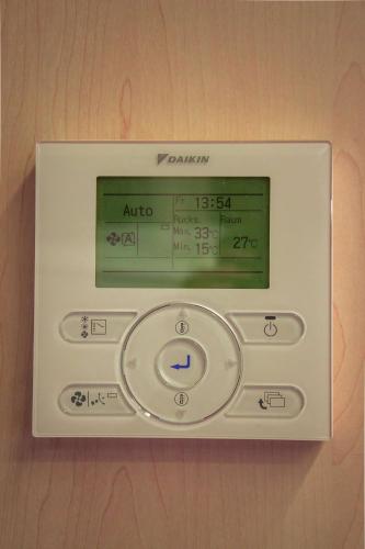 an electronic clock on a wall at Best Western Plaza Hotel Wels in Wels