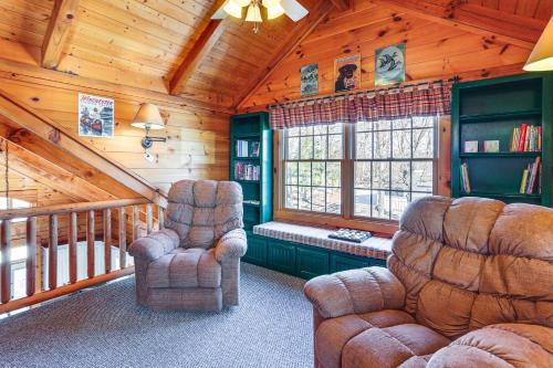 a living room with two chairs in a cabin at Private Boat Ramp and Dock Kentucky Lake Cabin! in Camden