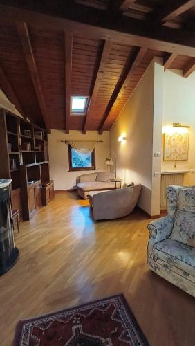 a large living room with a couch and a bed at Sottocastello 2 in Gorizia