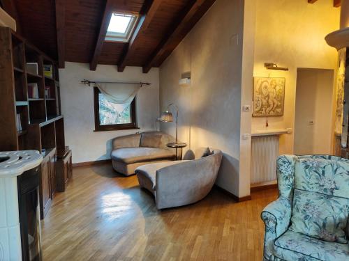 a living room with two chairs and a couch at Sottocastello 2 in Gorizia