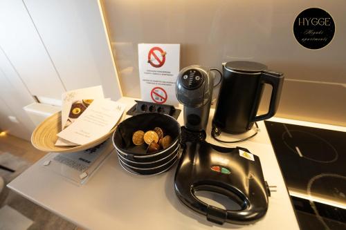a kitchen counter with a coffee maker and a mixer at Miyaki Apartments - BJELASNICA in Bjelašnica