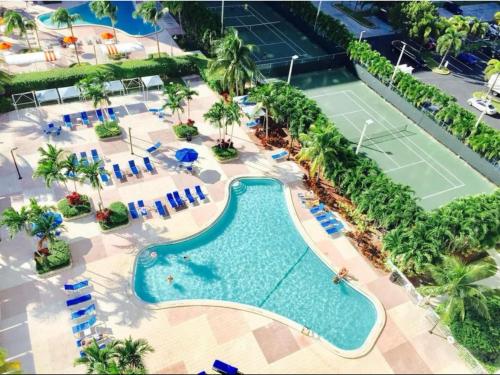 an aerial view of a tennis court and a pool at Family Stay Ocean Reserve Resort Sunny Isles in Sunny Isles Beach