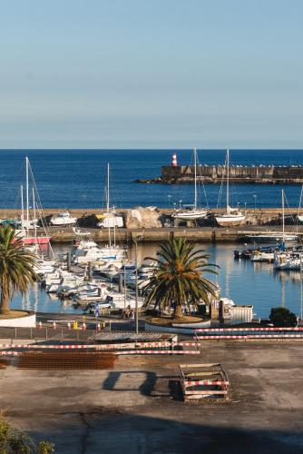 a marina with lots of boats in the water at Flor do Mar House in Ponta Delgada