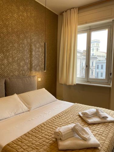 Postel nebo postele na pokoji v ubytování Le Due Torri ROOMS