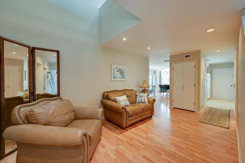 a living room with two chairs and a couch at Sunny Marco Island Gem with Shared Pool and Dock! in Marco Island
