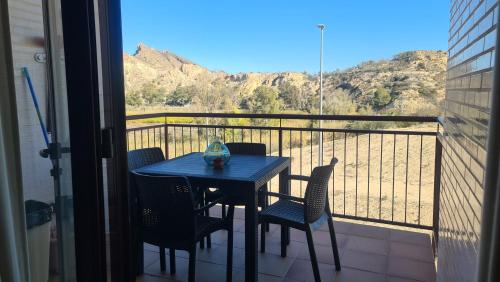 a table and chairs on a balcony with a view at SPA RELAX paradise in Villanueva de Río Segura