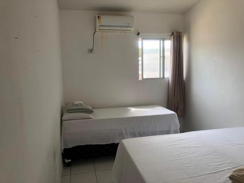 Katil atau katil-katil dalam bilik di Apartamento pé na areia em Maragogi