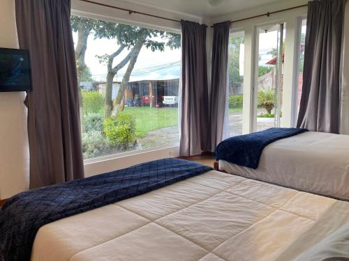 Postel nebo postele na pokoji v ubytování Apricot Hotel