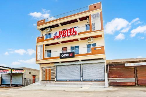 a building with a sign on the side of it at Hotel O Zoo Palace in Nagpur