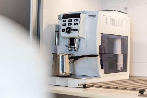 a coffee maker sitting on top of a counter at Ferienwohnungen Christoph in der Edelweißstraße in Pfaffing