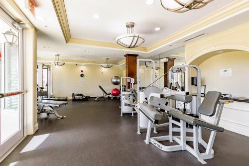 a gym with treadmills and machines in a room at Spacious 3BR 3BA with King Bed & Amazing Pools near Intercoastal, Lantana Beach, FL in Lantana