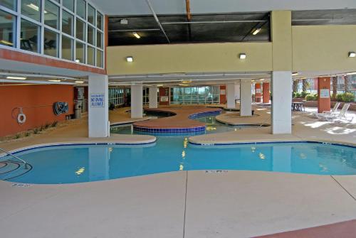 a pool in a building with a swimming pool at Malibu Pointe - 602 in Fall River