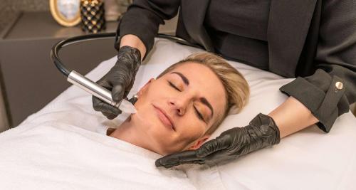 a woman laying in a hospital bed while being examined at Best Western Victor's Residenz-Hotel Rodenhof in Saarbrücken