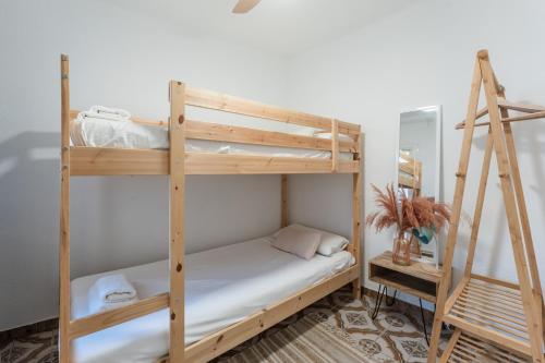 a bunk bed room with two bunk beds at Feel Welcome Barcelona 10 in Cornellà de Llobregat