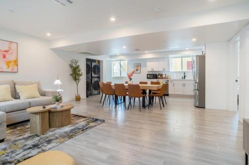 a living room and kitchen with a table and chairs at Cozy Urban Retreat near Downtown LA & USC - Private room with shared Living room and kitchen in Los Angeles