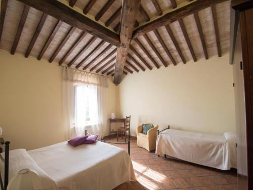 Katil atau katil-katil dalam bilik di Cottage in Tuscany with Private Pool & Wine
