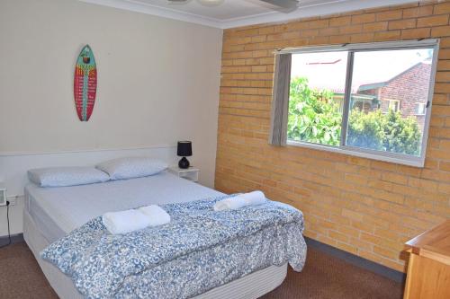 Postel nebo postele na pokoji v ubytování Wards Holiday Flat 7