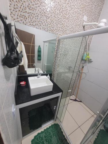 a bathroom with a sink and a shower at P nacional do catimbau Buíque de 1 a 10 hospeder in Catimbau