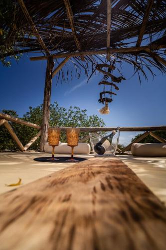 a table on a beach with a view of the ocean at Casa del Mar by Al Alma in San Onofre