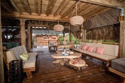 a living room with a couch and a table at Casa del Mar by Al Alma in San Onofre