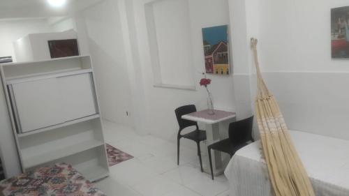 Ένα ή περισσότερα κρεβάτια σε δωμάτιο στο studio 4 pessoas