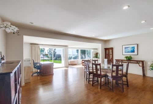 a kitchen and dining room with a table and chairs at Best Ocean & Bay Views in SD Large Backyard Air Conditioning in San Diego