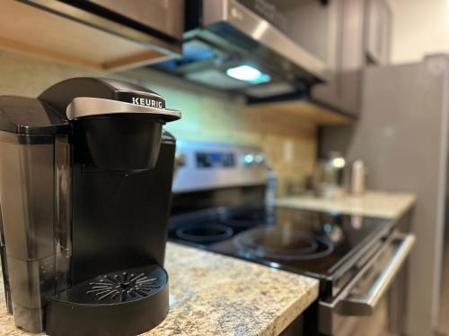 a coffee maker sitting on a counter in a kitchen at Seven Bears in the Woods -Modern-Luxury-Cabin--Hot Tub-Game Room in Sevierville