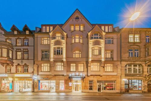 a large building in front of a street at Best Western Plus Hotel Excelsior in Erfurt