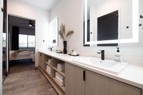 a bathroom with a sink and a mirror at Villas 1, 2, 4 The Villas At Troon North in Scottsdale