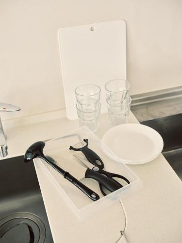 a pair of scissors and glasses on a kitchen counter at vetta kumamoto shinyashiki 701 in Kumamoto