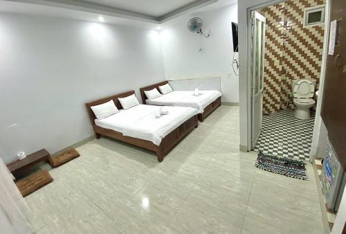 Ένα ή περισσότερα κρεβάτια σε δωμάτιο στο Hotel thiên ý
