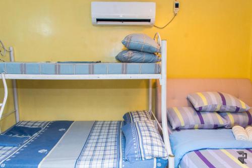 Katil atau katil-katil dalam bilik di Affordable Up to 16 Pax Near Aqua Planet & Clark International Airport
