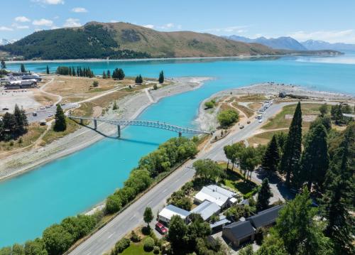 an aerial view of a bridge over a river at Aldourie Lodge - Lake Tekapo in Lake Tekapo