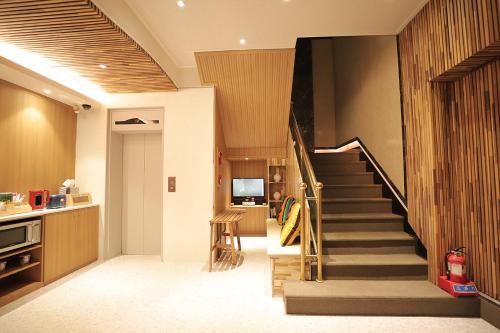 a hallway with a staircase in a house at Gyeongju Liebe Stay in Gyeongju