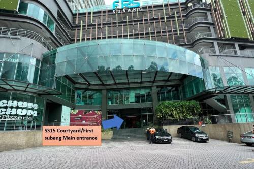 a building with two cars parked in front of it at SS15 Courtyard Subang Jaya Sunway 3 Pax Studio Big 65 Inch TV Netflix WiFi #21 in Subang Jaya
