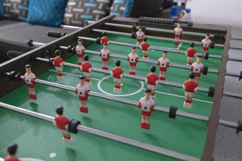 a model of a table with a soccer game at Sea Lion Serenity Retreat - New Construction 2024 in Port Saint Lucie