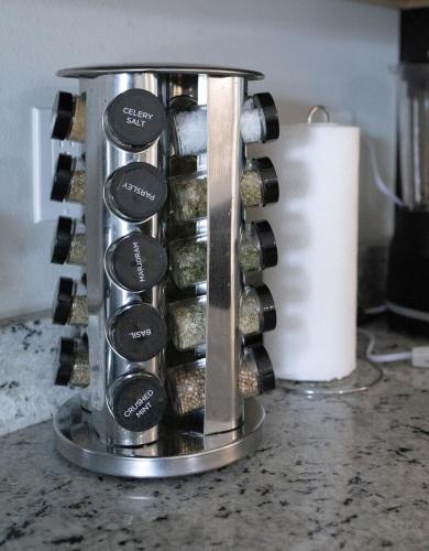 a bunch of wine bottles in a container on a counter at Sea Lion Serenity Retreat - New Construction 2024 in Port Saint Lucie