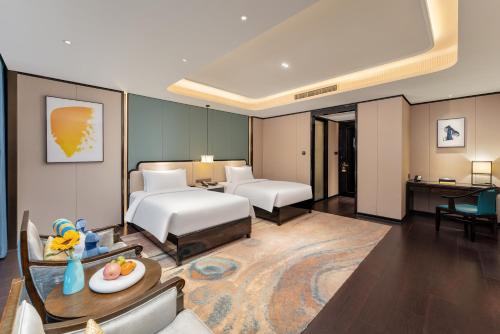 voco - Hangzhou Binjiang Minghao by IHGにあるベッド