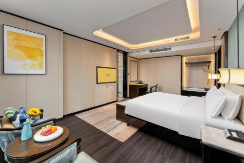 voco - Hangzhou Binjiang Minghao by IHGにあるベッド