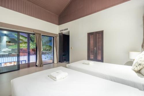 Ένα ή περισσότερα κρεβάτια σε δωμάτιο στο Pasak Villa