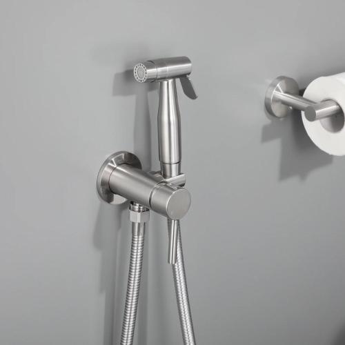a shower head in a bathroom with a roll of toilet paper at RG Boutique Hotel in Yerevan