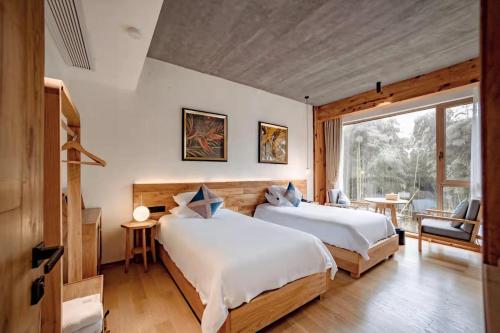 Postel nebo postele na pokoji v ubytování Kaichen Puju Hot Spring Village Resort Hotel