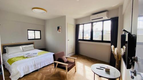 Ein Bett oder Betten in einem Zimmer der Unterkunft 希沐溫泉民宿