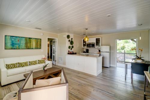 a living room with a couch and a table at Crane's Beach House Boutique Hotel & Luxury Villas in Delray Beach